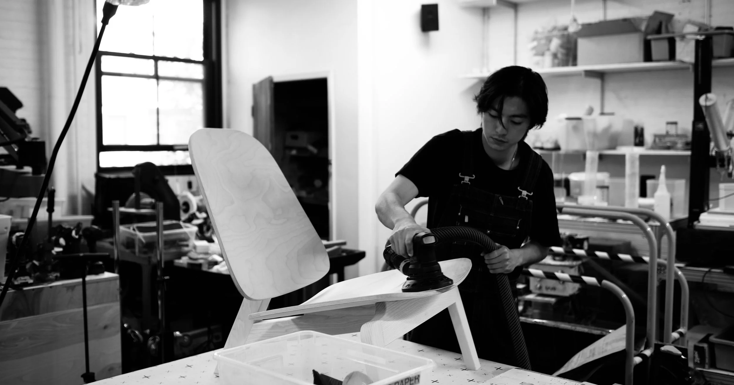 Alvin Lo working on a furniture piece in the studio
