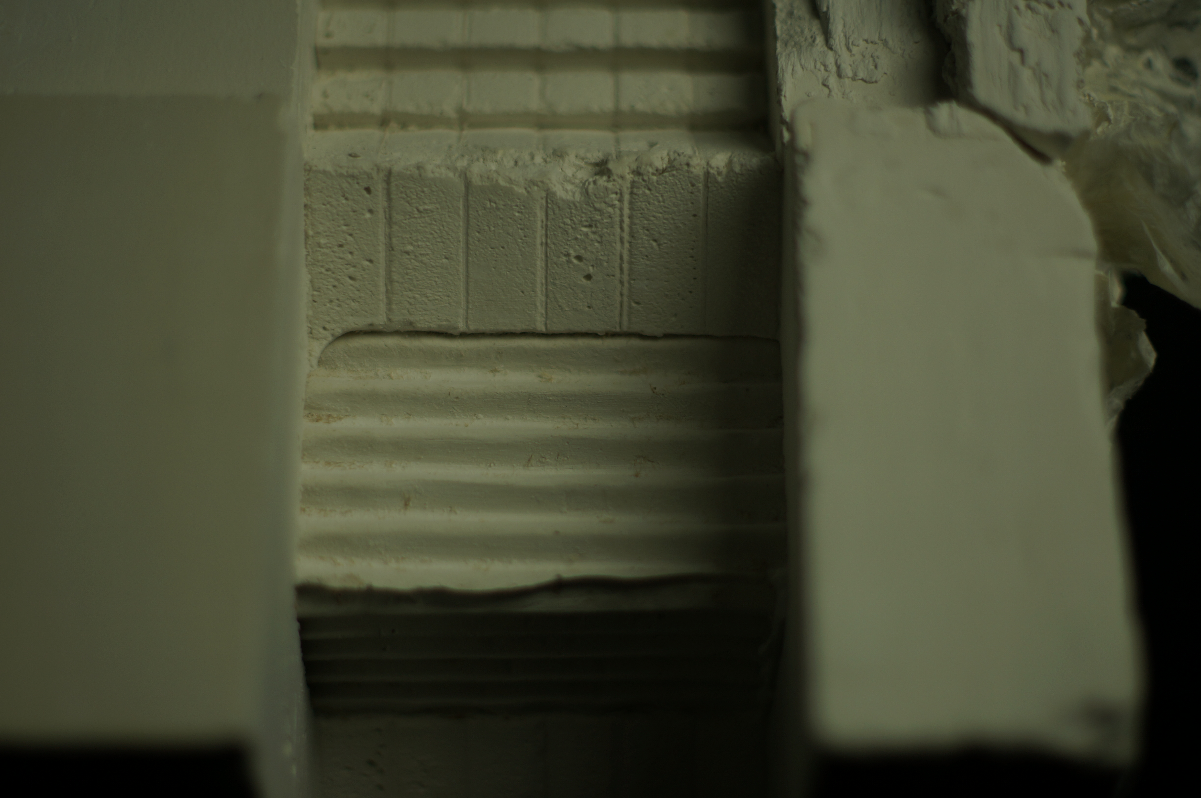Detailed view of grooves and voids in the plaster casting