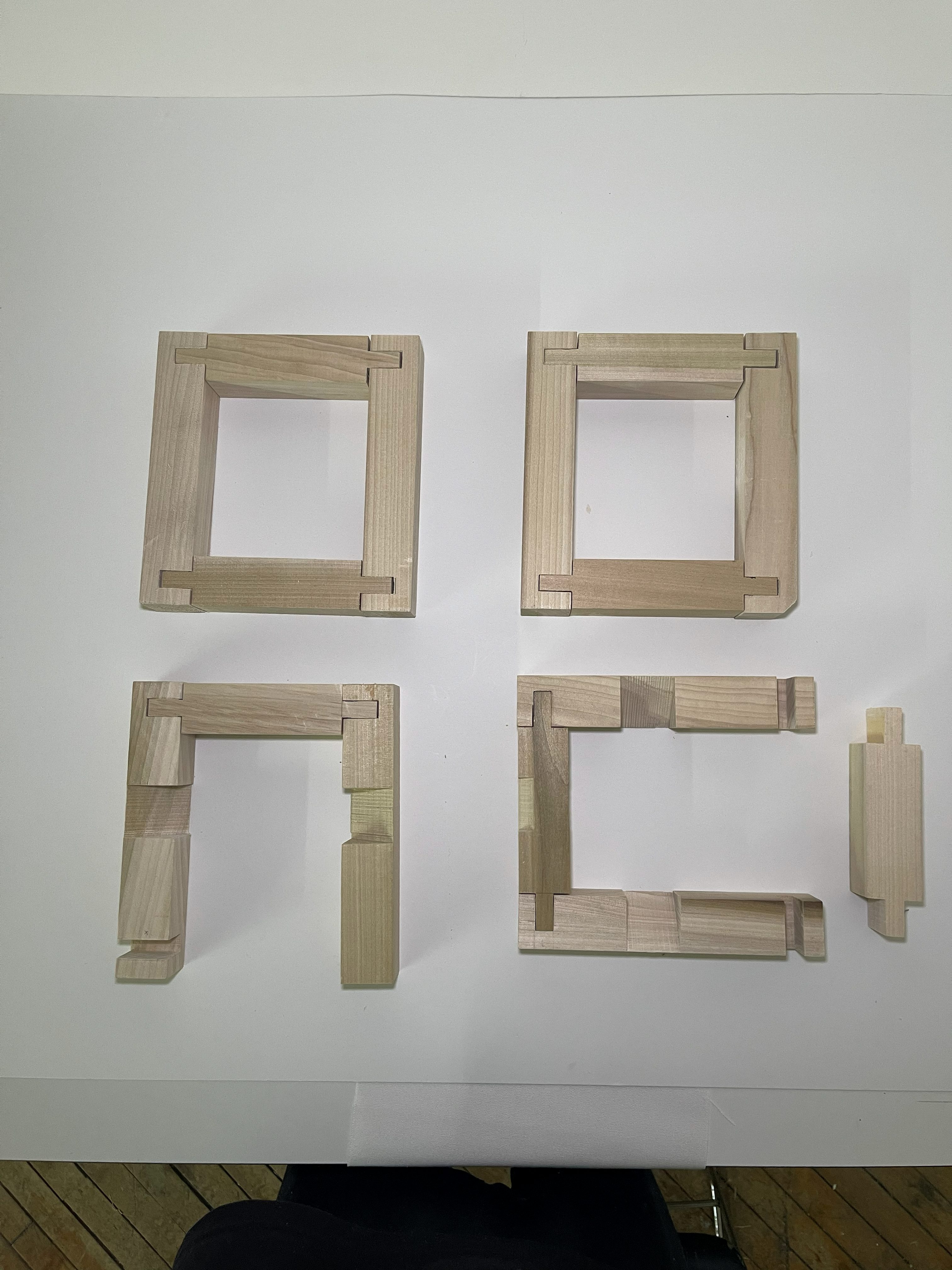 Disassembled timber frames showing the construction system