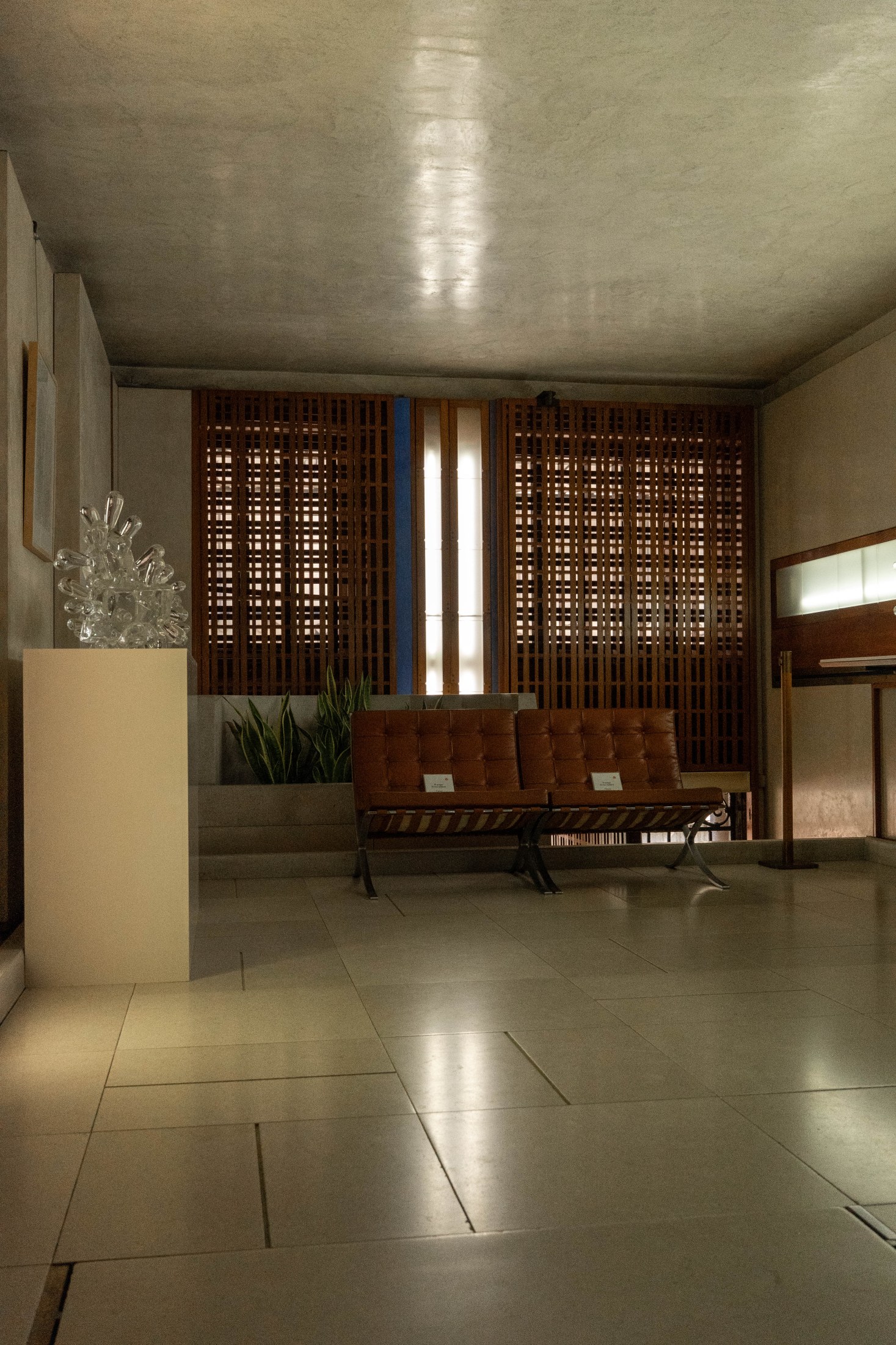 Upper lounge and glass display photographed inside the Olivetti Showroom