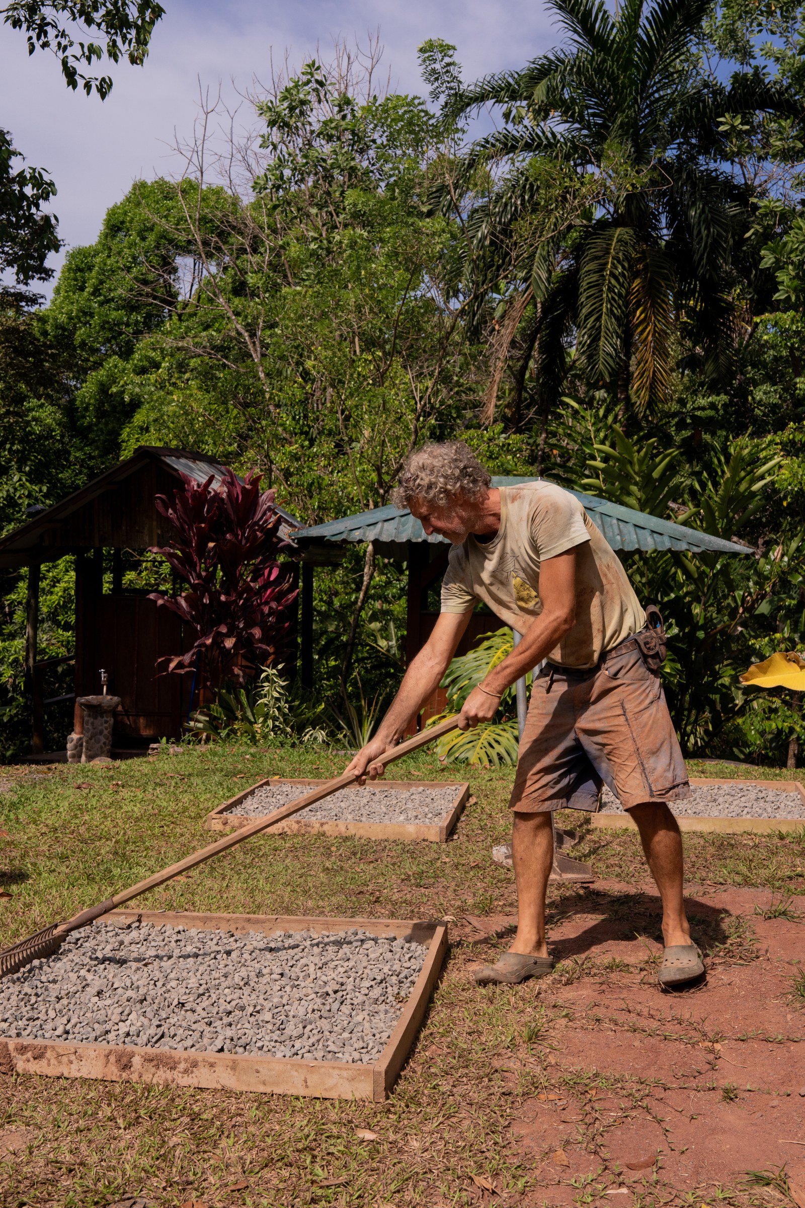 Aggregate being leveled in an outdoor material demonstration